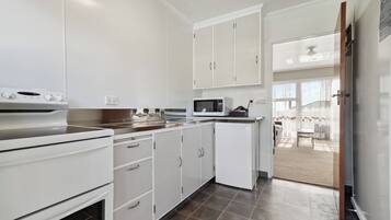 Fridge, microwave, oven, cookware/dishes/utensils