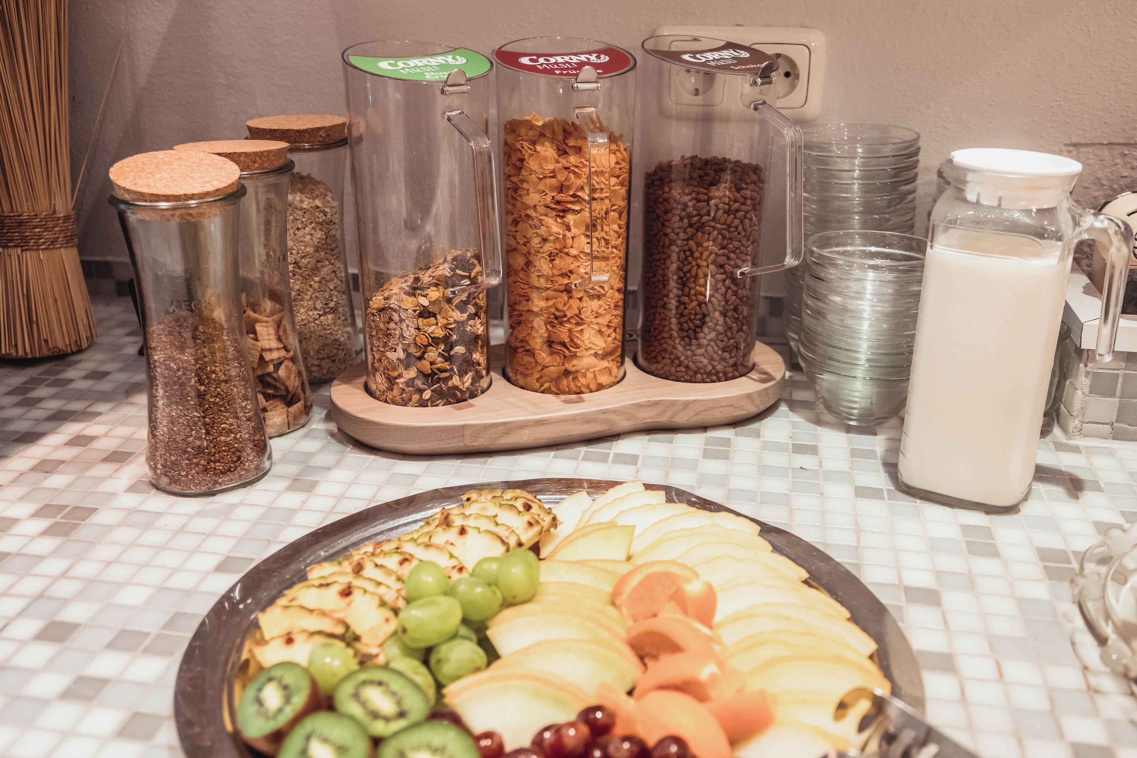 A breakfast buffet with various food items and containers.