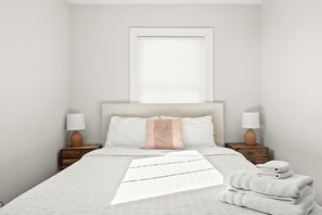 A neatly made bed with a white comforter and pillows, a bedside table with a lamp, and a window with blinds. - Adorable Broad Ripple Duplex! (Indianapolis)