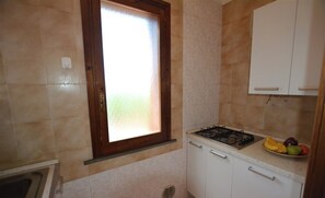 Fridge, stovetop, dishwasher, coffee/tea maker