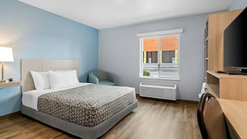 Suite, 1 Queen Bed, Roll-in Shower, Non Smoking | Desk, laptop workspace, blackout drapes, iron/ironing board