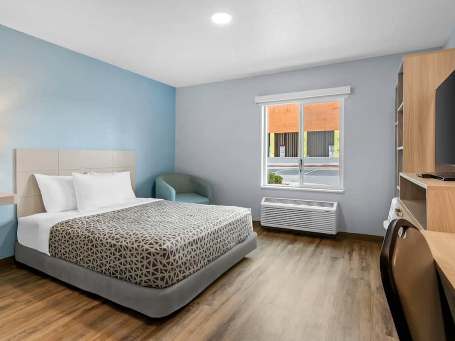 Suite, 1 Queen Bed, Roll-in Shower, Non Smoking | Desk, laptop workspace, blackout drapes, iron/ironing board