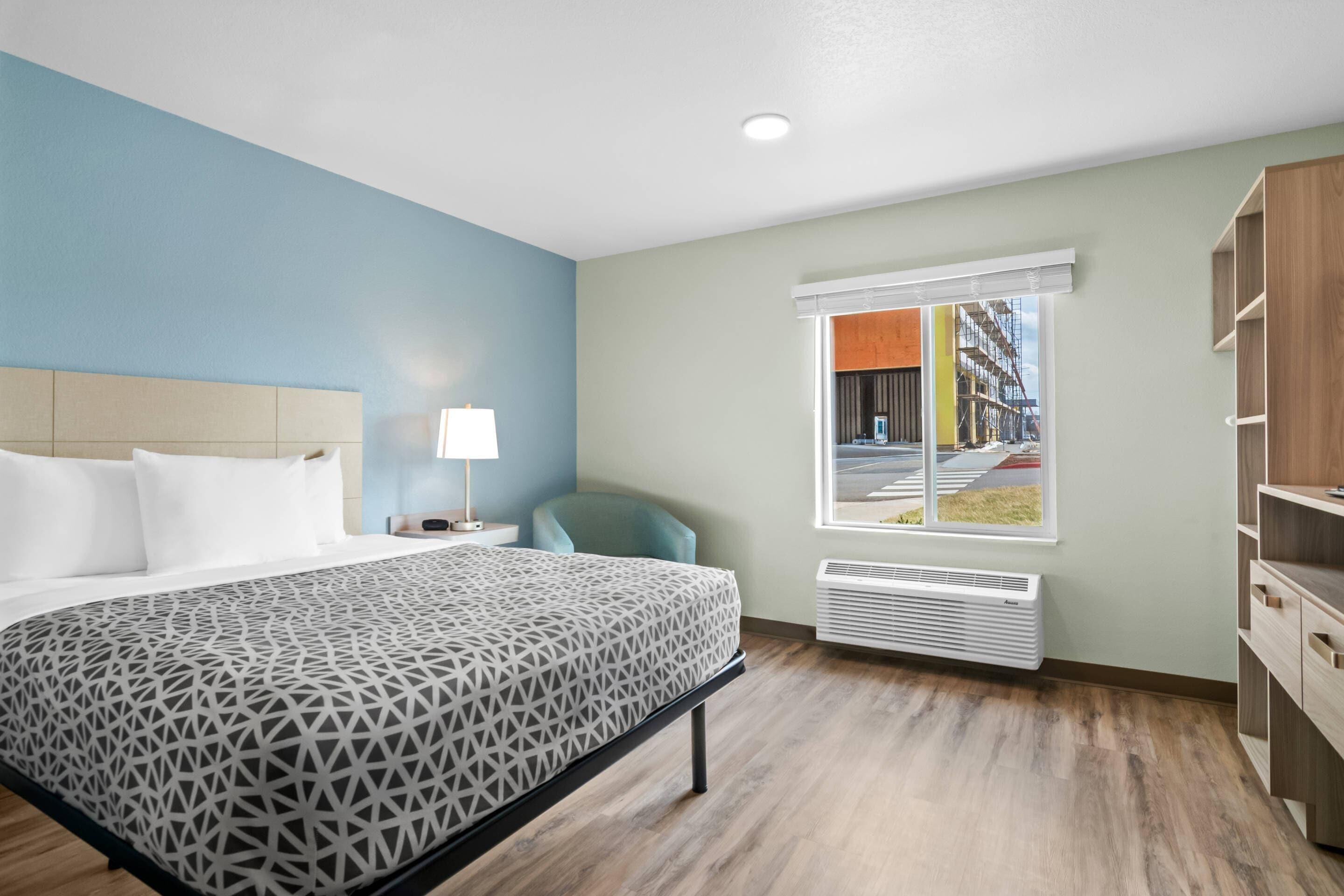 Suite, 1 Queen Bed, Non Smoking | Desk, laptop workspace, blackout drapes, iron/ironing board