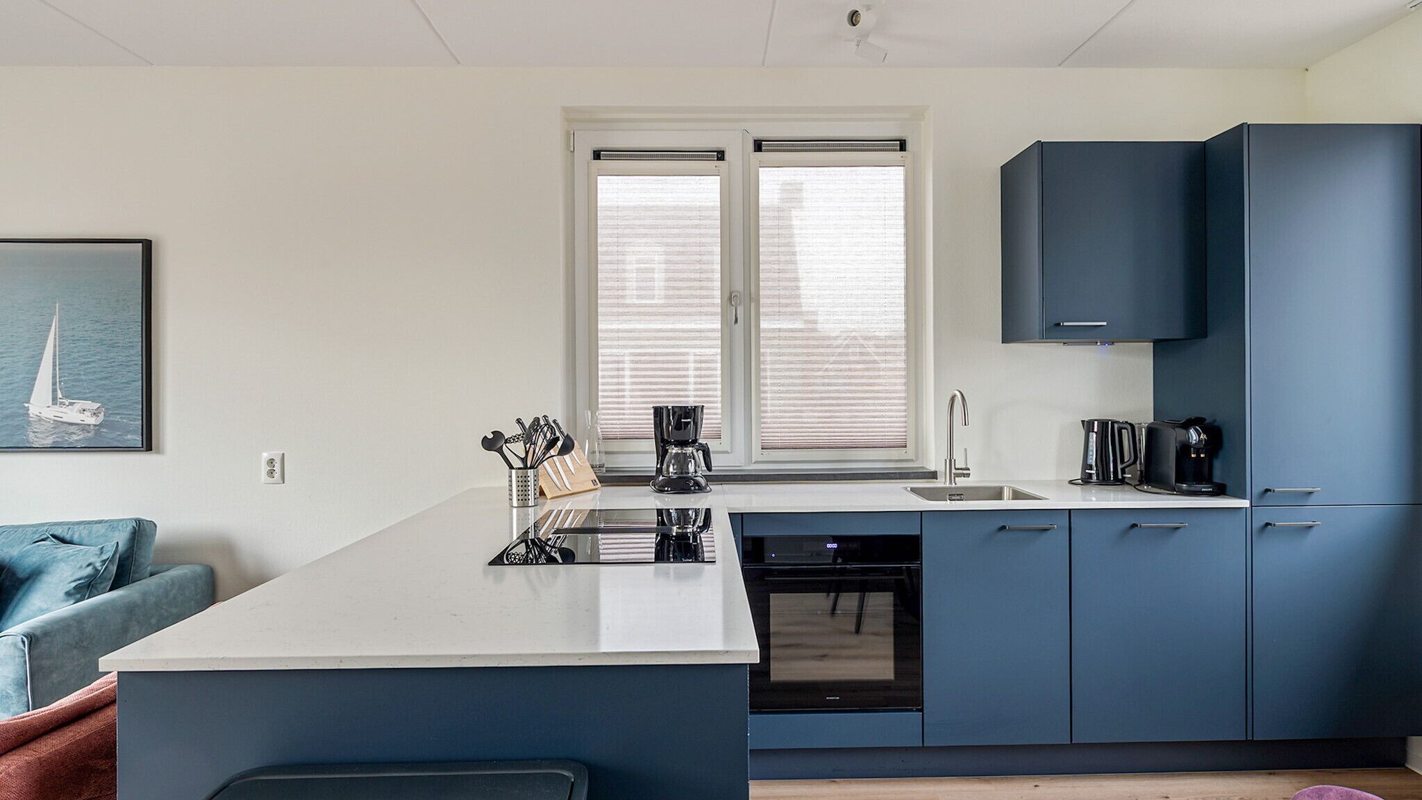 Fridge, stovetop, dishwasher, coffee/tea maker