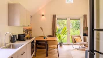 Fridge, stovetop, dishwasher, coffee/tea maker
