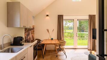 Fridge, stovetop, dishwasher, coffee/tea maker