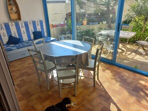 Relax in this inviting space with a patio leading out to a tranquil outdoor area.