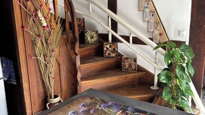 A staircase with wooden railings and a white wall. - Vacation apartment/house with 2 bedrooms in the historic Vierkanthof (Mechernich)