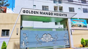 A gated entrance to Golden Mango Heights with a sign above the gate. - Comfort home! made life simple, Beautiful views and desirable lifestyle. (Nairobi)
