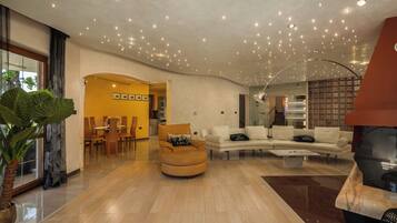 Family Villa, Multiple Bedrooms (Villa Rosa Magica) | Living area | 21-inch flat-screen TV with cable channels