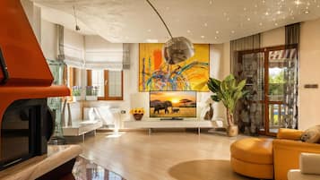 Family Villa, Multiple Bedrooms (Villa Rosa Magica) | Living area | 21-inch flat-screen TV with cable channels