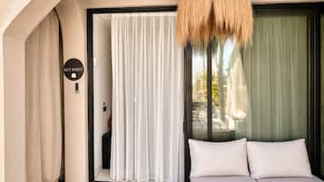 Deluxe with Pool View | Living area | 100-cm TV with satellite channels, Netflix, foosball