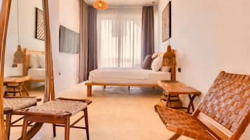 King Room With Pool View | Minibar, in-room safe, individually decorated, soundproofing