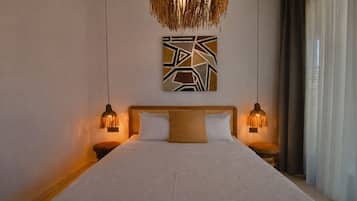 Deluxe Suite With Garden View | Minibar, in-room safe, individually decorated, soundproofing