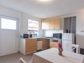 Microwave, oven, dining tables