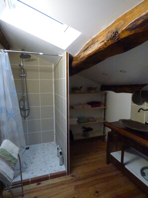 Shower, hair dryer, towels, toilet paper