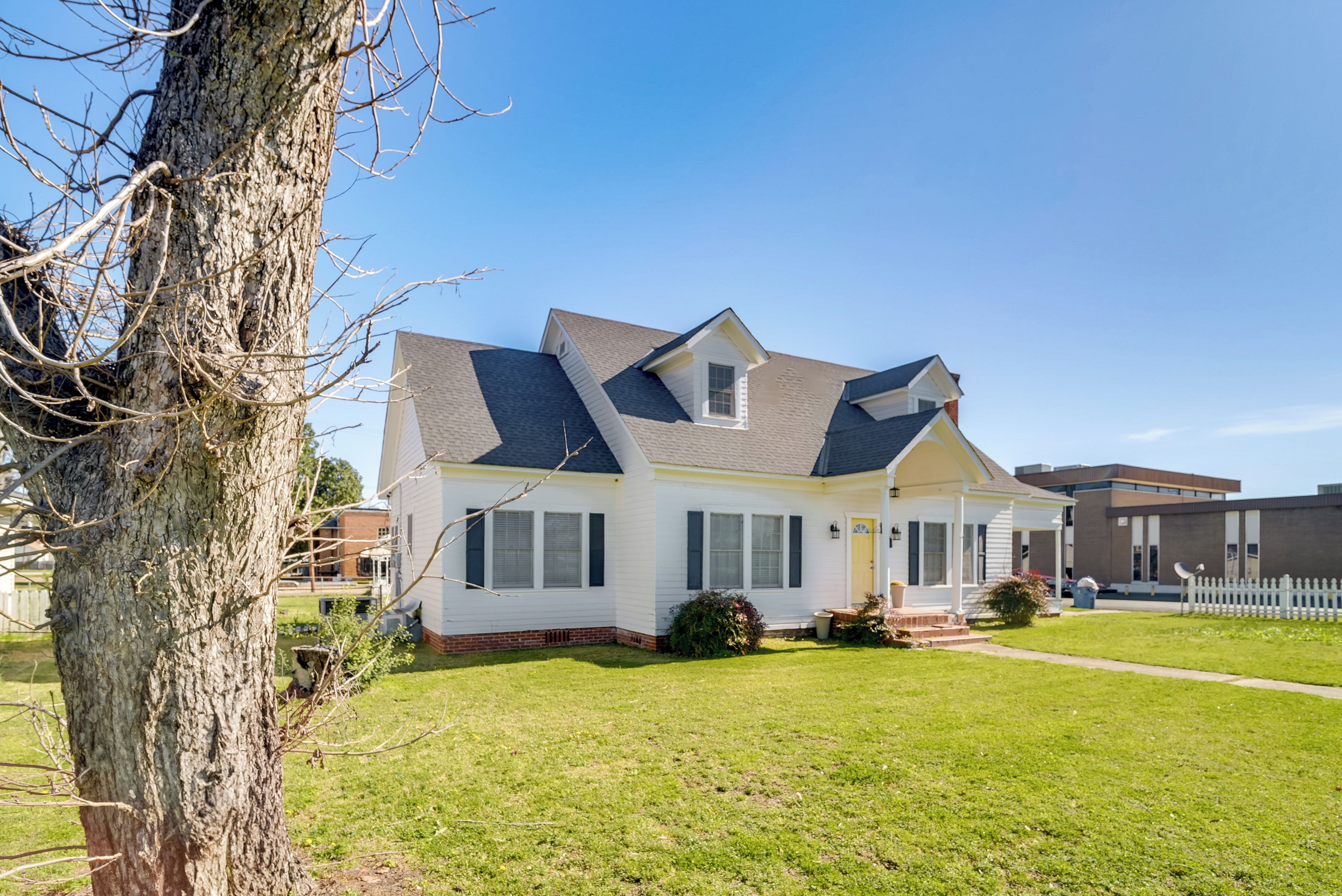 A single-story house with a gabled roof, a front porch, and a small attached garage.