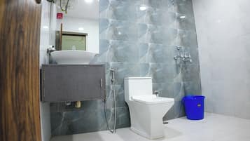 Luxury Suite, City View | Bathroom | Shower, rainfall showerhead, free toiletries, slippers