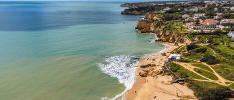On the beach, sun-loungers