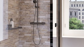 A modern shower with a rain showerhead and handheld showerhead, set against a brick wall. - Heart Holiday in Sorrento (Sorrento)