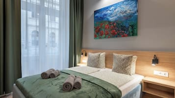 Superior Studio | Desk, laptop workspace, blackout drapes, soundproofing