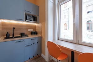 Apartment | Private kitchen | Mini-fridge, microwave, stovetop, cookware/dishes/utensils