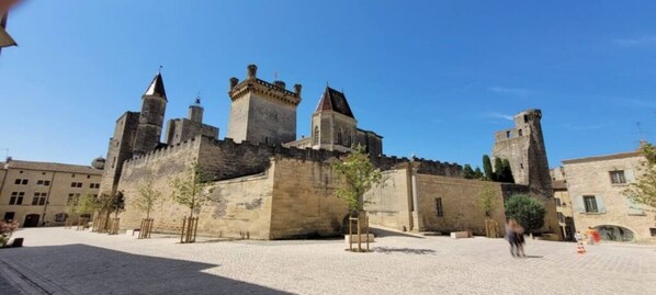 A historic stone castle with multiple towers and a courtyard.