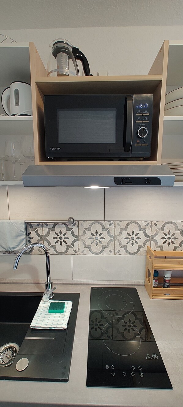 Fridge, microwave, stovetop, coffee/tea maker