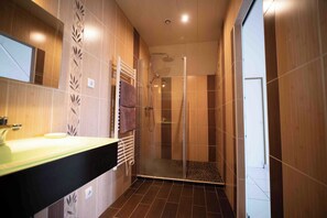 Shower, hair dryer, soap, toilet paper