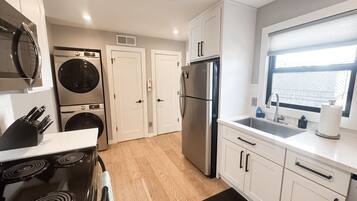 Fridge, coffee/tea maker, cookware/dishes/utensils, spices