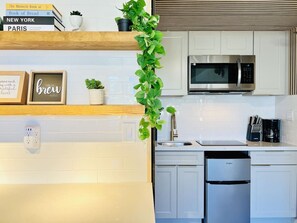 Fridge, microwave, stovetop, coffee/tea maker