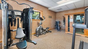 A gym with exercise equipment, a window, and a door. - 1BR Village At Indian Point 1107 next to SDC- Free Tickets Daily up to $500 (Branson)