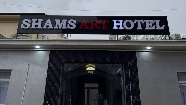 The entrance to Shams Art Hotel with a modern facade and a prominent sign above the entrance. - Shams Art Hotel (Tashkent)