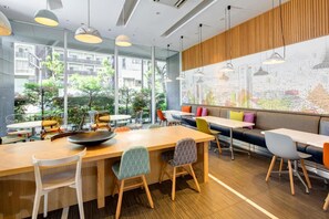 Enjoy meals in this dining area with a long table and comfortable seating.