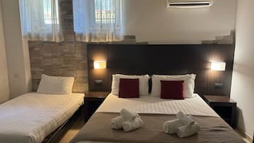 Classic Triple Room | Free minibar items, desk, laptop workspace, free WiFi