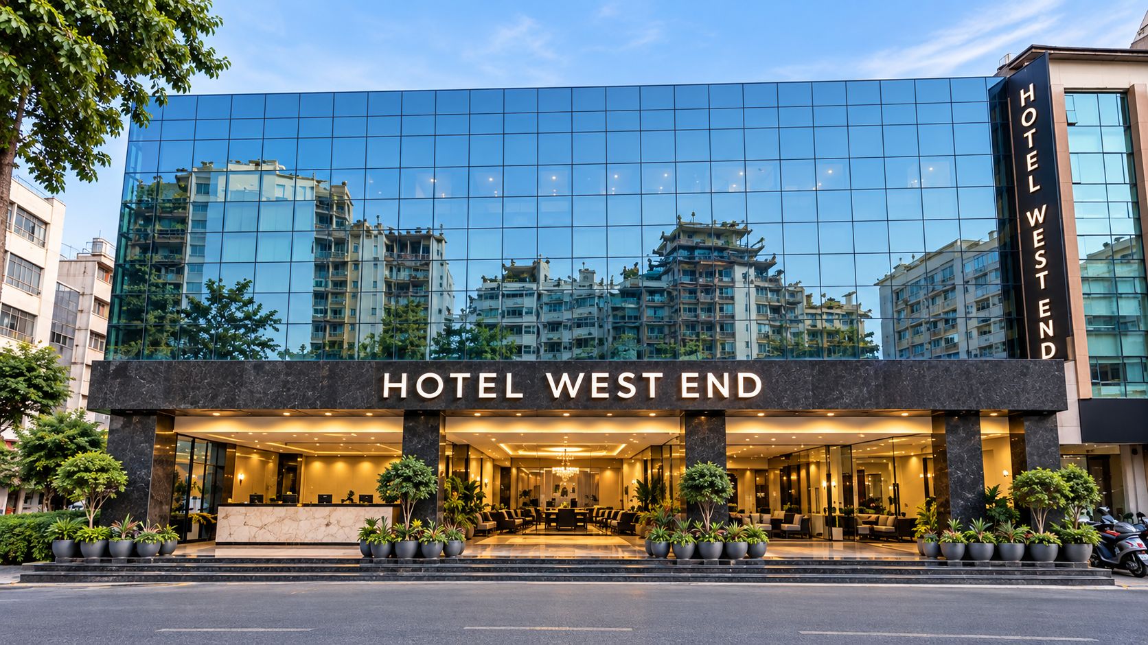 A modern hotel with a reflective glass facade, a prominent entrance, and a name sign.