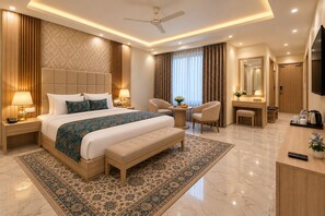 A modern hotel room with a large bed, a desk, a chair, a television, and a bathroom. - Hotel West End Mahipalpur Delhi IGI (New Delhi)