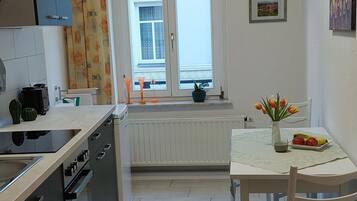 Fridge, stovetop, dishwasher, coffee/tea maker