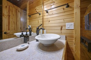 Jetted bath, hair dryer, towels, shampoo