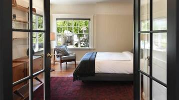 1 bedroom, desk, iron/ironing board, travel crib