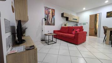 Lägenhet - 1 sovrum - balkong - utsikt mot staden | Vardagsrum | Böcker