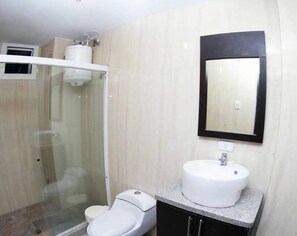 Bathtub, towels, soap, toilet paper
