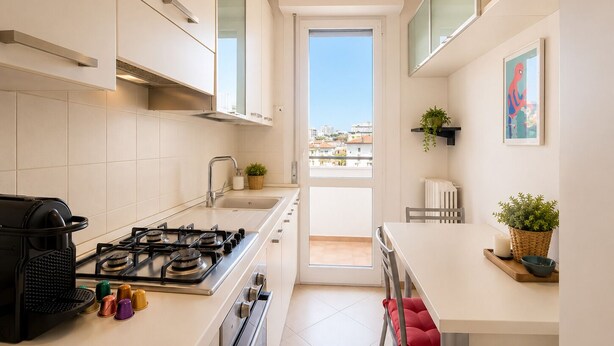 A modern kitchen with a gas stove, oven, and a coffee machine. - New Pop Art Suit with Parking (Unknown)