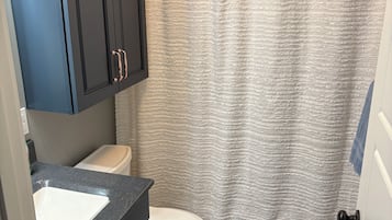 Hair dryer, towels, soap, toilet paper