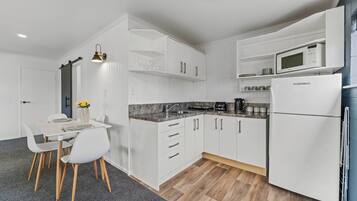 Fridge, microwave, toaster, cookware/dishes/utensils