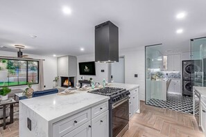 Enjoy cooking in this well-equipped kitchen with a gas stove and ample counter space.