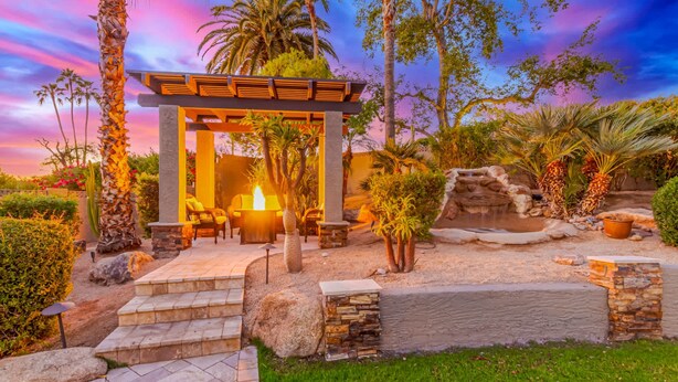 A gazebo with outdoor seating, surrounded by palm trees and a small waterfall. - NEW Parkwood Retreat w Pool Spa Kierland (Scottsdale)