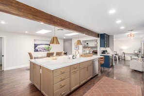 Enjoy cooking in this well-equipped kitchen with a large island and ample counter space.