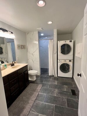 Shower, hair dryer, towels, soap