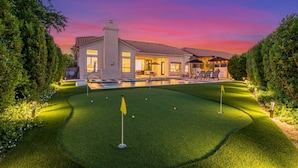 A modern house with a swimming pool, well-manicured lawn, and outdoor seating area. - Anderson LUX Estate Private Bar Pool Sleeps 12 (Scottsdale)
